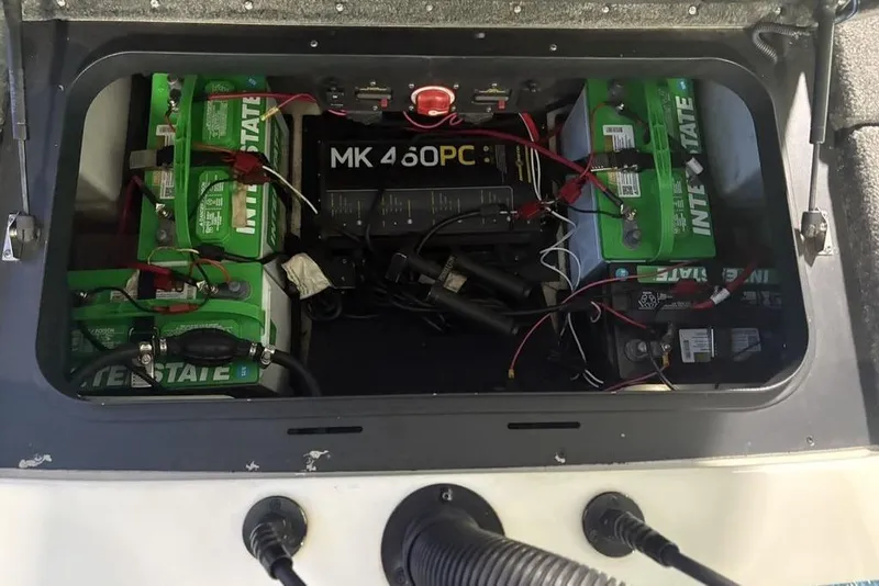 Slide: The Image of 2014 Skeeter FX20 boat battery compartment with Interstate batteries and MK 460PC charger. - 31