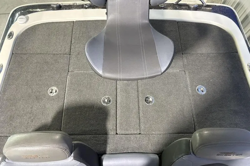 Slide: The Image of 2014 Skeeter FX20 boat interior with gray seating and carpeted deck. - 32