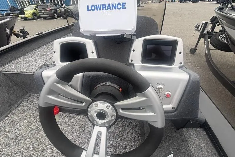 Slide: The Image of 2026 Tracker Pro Team 175 boat dashboard with Lowrance electronics and steering wheel. - 11