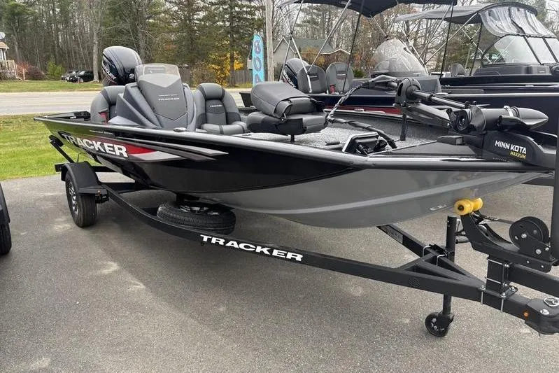 The Image of 2026 Tracker Pro Team 175 boat on trailer, parked outdoors. - 2