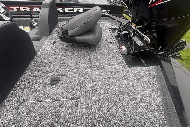Slide: The Image of 2026 Tracker Pro Team 175 boat interior with gray seating and motor. - 8
