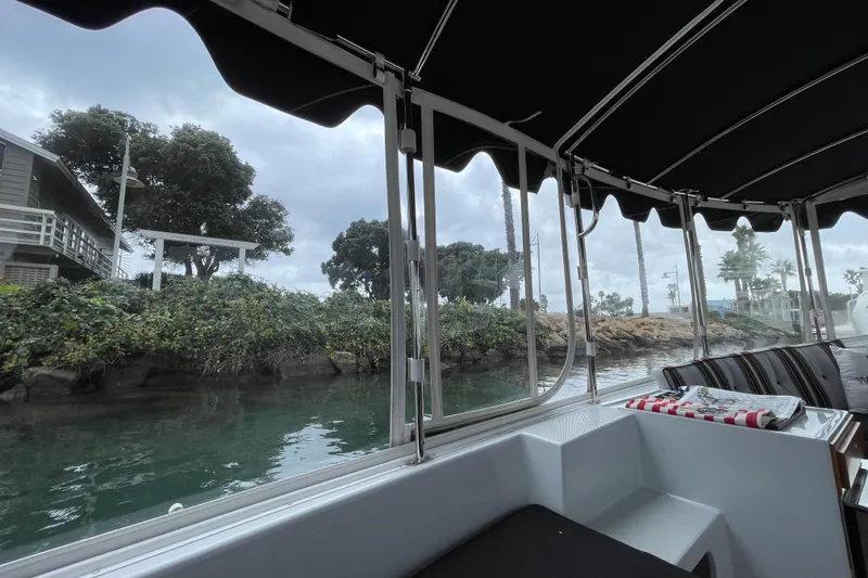 Slide: The Image of 2020 Duffy Snug Harbor 18 boat interior with scenic waterfront view. - 14