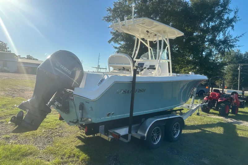 Slide: The Image of 2023 Sailfish 220 CC boat on trailer with Yamaha outboard motor in sunny outdoor setting. - 6