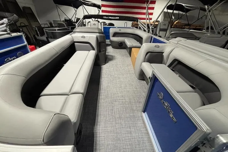 Slide: The Image of 2026 Sun Tracker Party Barge 18 DLX interior with spacious seating and modern design. - 4