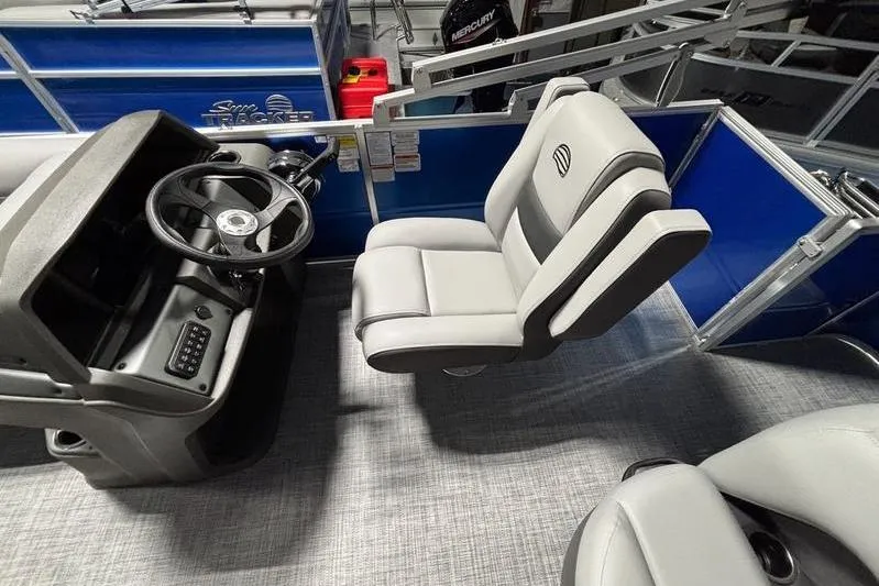 Slide: The Image of 2026 Sun Tracker Party Barge 18 DLX interior with steering console and seating. - 5