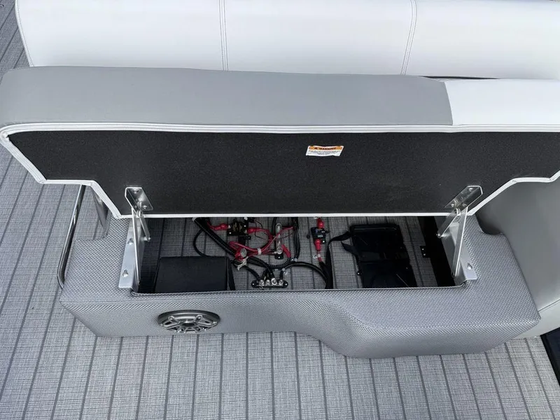 Slide: The Image of Open storage compartment in 2025 Godfrey Monaco 235 SFL iMPACT pontoon boat, showing wiring and components. - 15