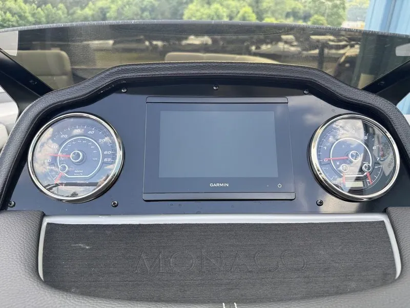 Slide: The Image of Dashboard of 2025 Godfrey Monaco 235 SFL with Garmin display and gauges. - 18