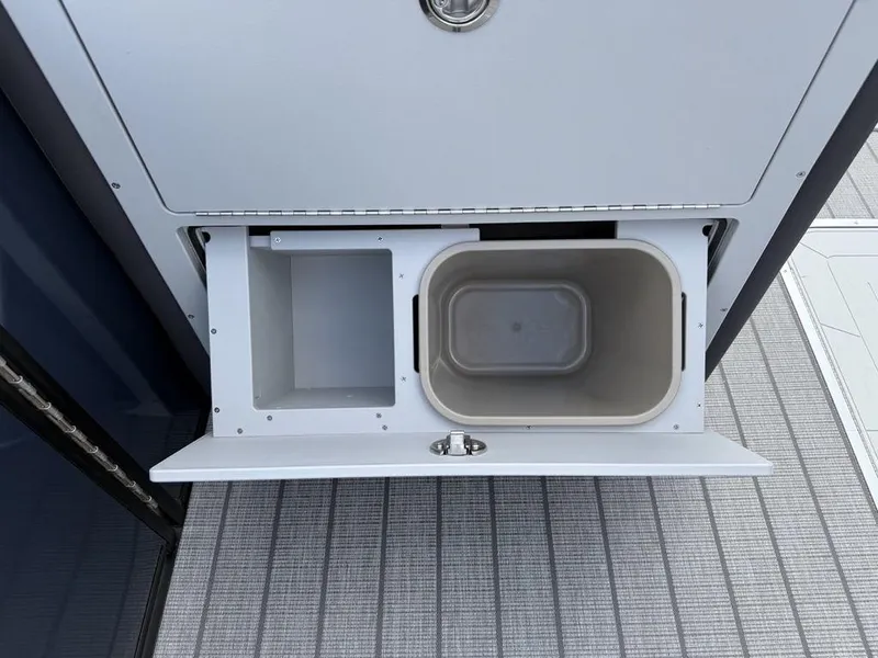 Slide: The Image of Storage compartment with bin on 2025 Godfrey Monaco 235 SFL iMPACT Package boat. - 20