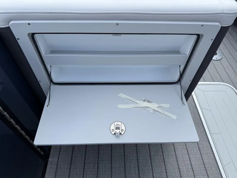 Slide: The Image of Open storage compartment on 2025 Godfrey Monaco 235 SFL iMPACT boat, showcasing interior space. - 22
