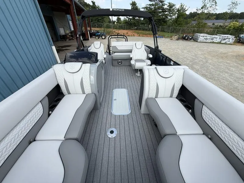 Slide: The Image of 2025 Godfrey Monaco 235 SFL iMPACT pontoon boat interior with luxurious seating and modern design. - 27