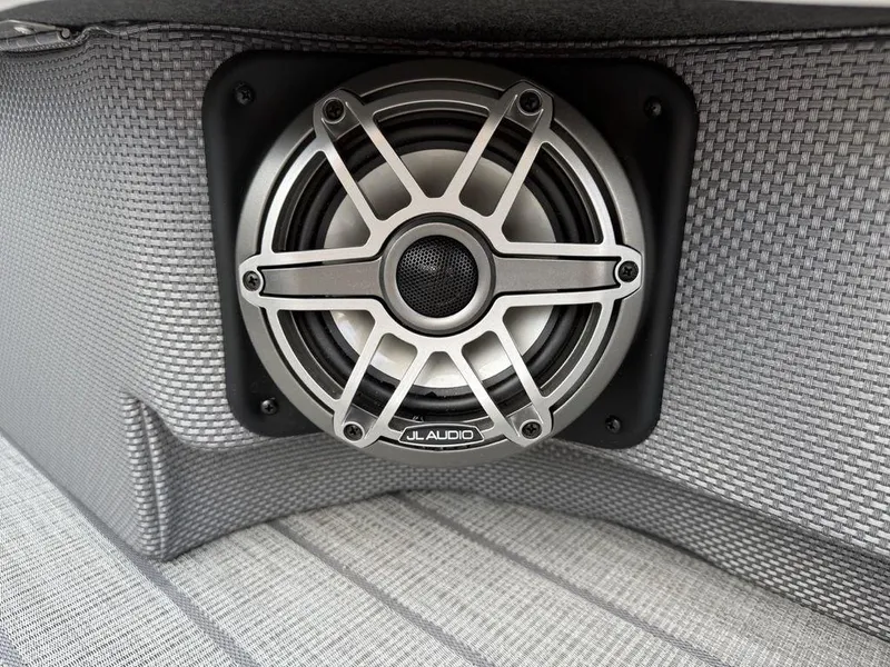 Slide: The Image of JL Audio speaker on 2025 Godfrey Monaco 235 SFL iMPACT boat, gray woven upholstery. - 28