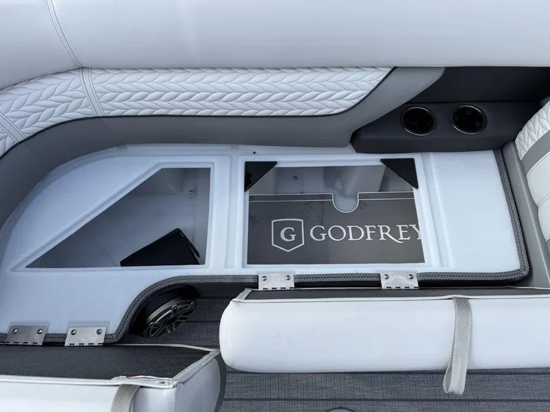 Slide: The Image of Interior of 2025 Godfrey Monaco 235 SFL boat with stylish seating and storage compartment. - 7
