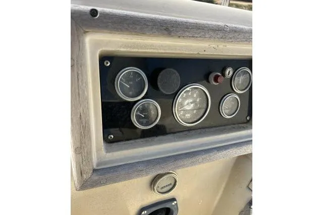 Slide: The Image of Instrument panel of a 1977 Islander 36 sailboat with gauges and controls. - 13
