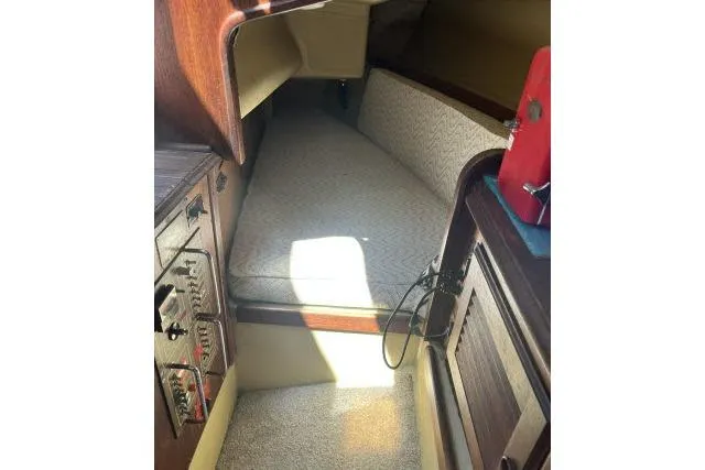 Slide: The Image of Interior cabin of a 1977 Islander 36 sailboat with cozy sleeping area. - 8