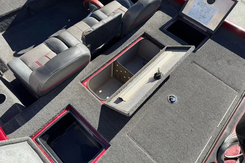 Slide: The Image of 2016 Ranger RT178 boat interior with open storage compartments and seating. - 15