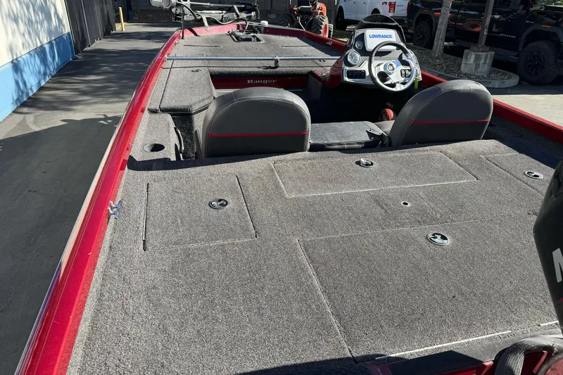 Slide: The Image of 2016 Ranger RT178 fishing boat interior with steering console and carpeted deck. - 4