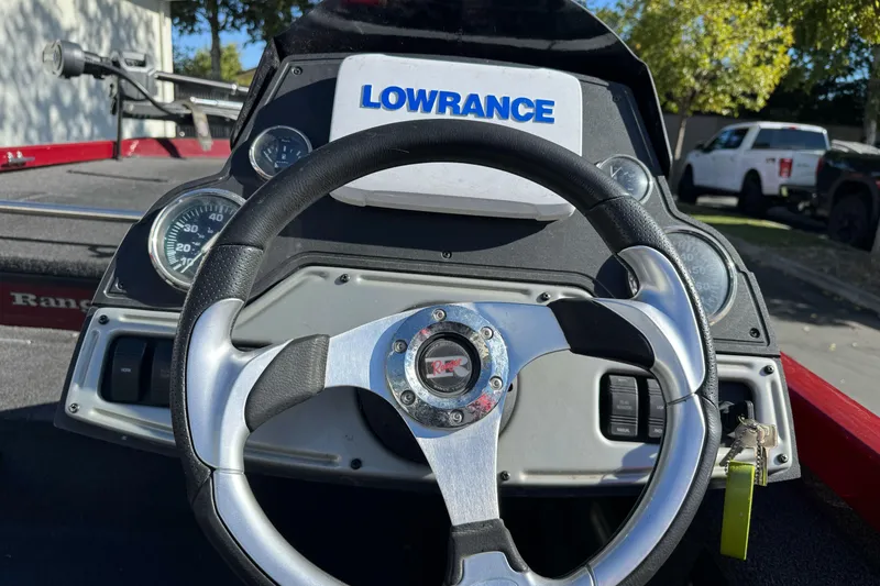 Slide: The Image of 2016 Ranger RT178 boat dashboard with steering wheel and Lowrance display. - 5