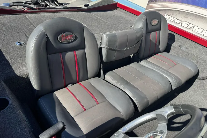 Slide: The Image of 2016 Ranger RT178 boat seats with red accents and steering wheel. - 7