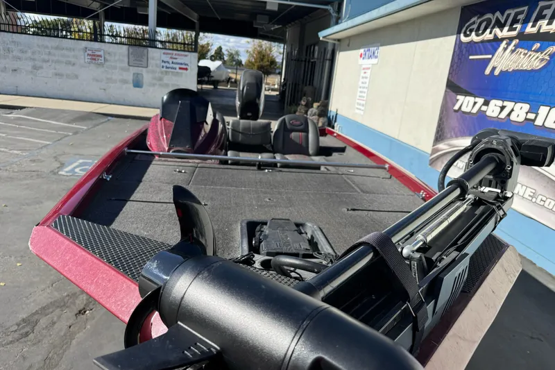 Slide: The Image of 2016 Ranger RT178 boat with trolling motor, parked outdoors near a marine service center. - 9