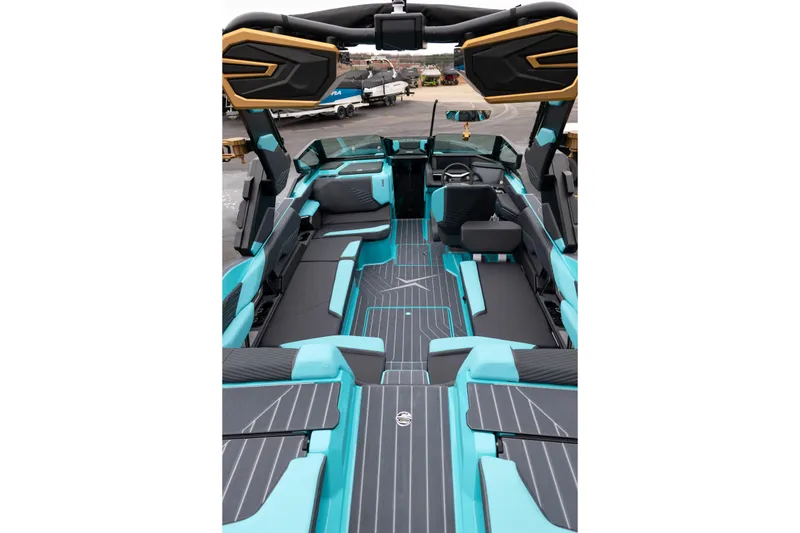 Slide: The Image of 2026 MasterCraft X24 boat interior with turquoise and black seating, modern design. - 11