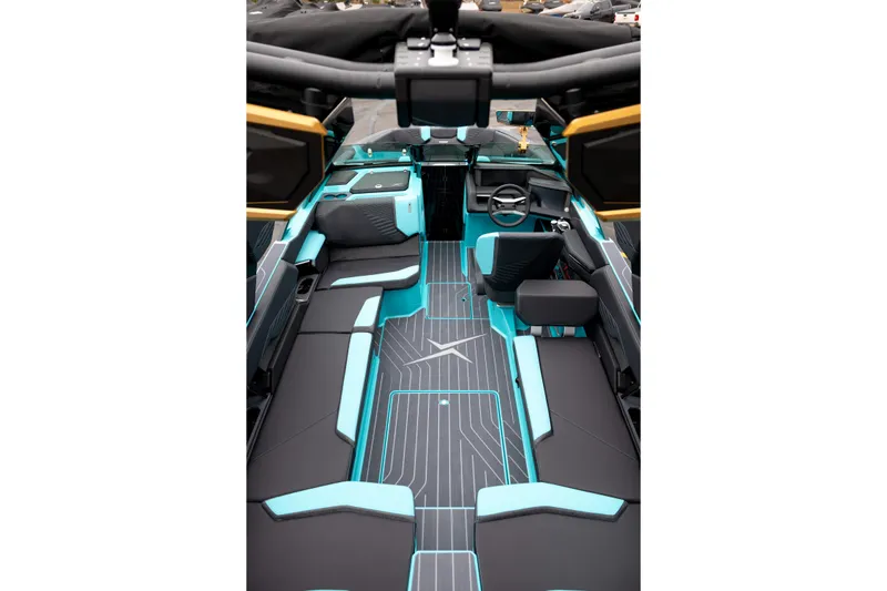 Slide: The Image of 2026 MasterCraft X24 boat interior with modern design and turquoise accents. - 16