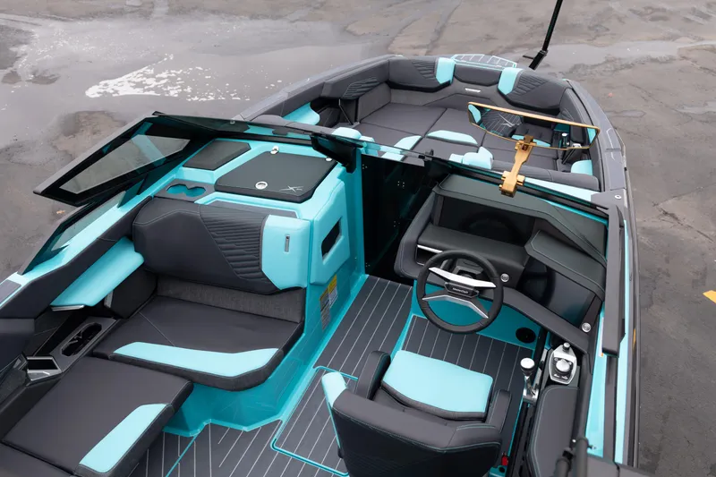 Slide: The Image of 2026 MasterCraft X24 boat interior with sleek design and modern seating. - 17