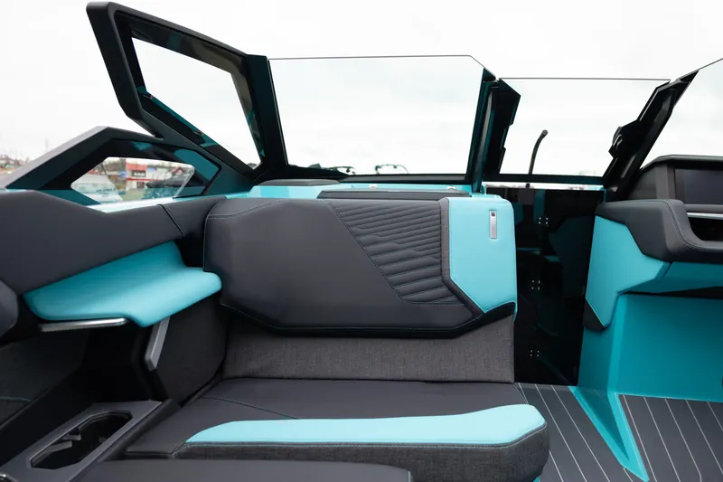 Slide: The Image of Interior of 2026 MasterCraft X24 boat with modern teal and black seating. - 20
