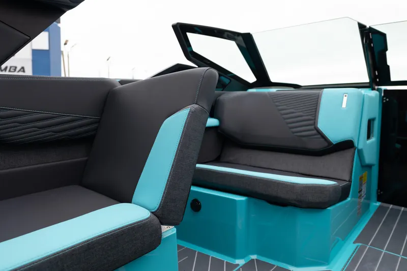 Slide: The Image of 2026 MasterCraft X24 interior with sleek black and turquoise seating design. - 25