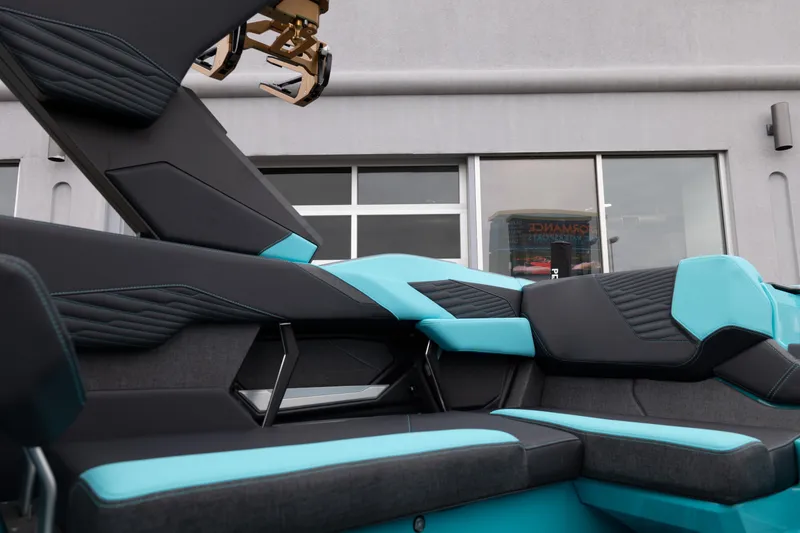 Slide: The Image of 2026 MasterCraft X24 boat interior with modern black and teal seating design. - 28