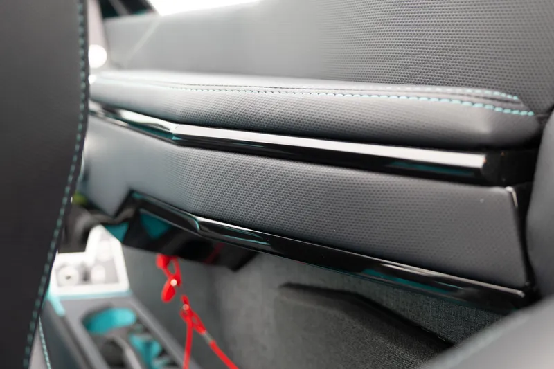 Slide: The Image of 2026 MasterCraft X24 interior detail with sleek black and gray design elements. - 35