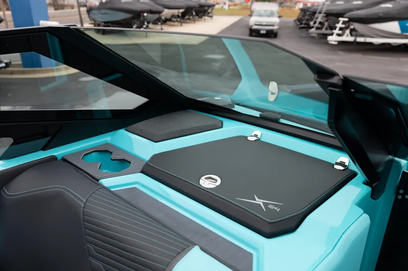 Slide: The Image of 2026 MasterCraft X24 boat interior with sleek design and turquoise accents. - 37