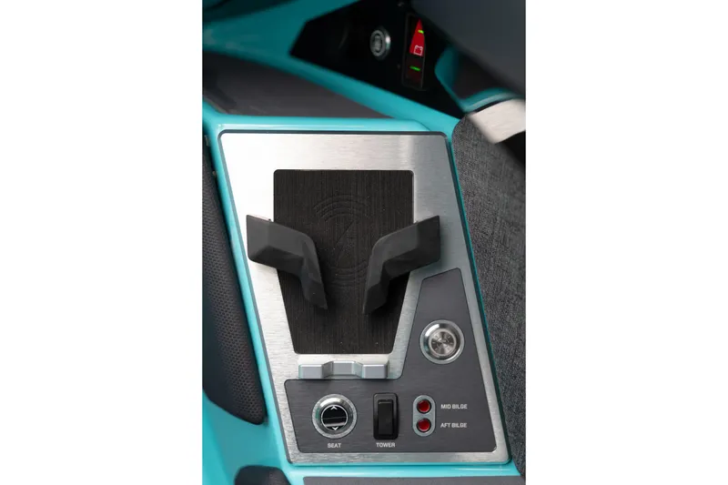 Slide: The Image of Control panel of 2026 MasterCraft X24 boat with switches and cup holder. - 38