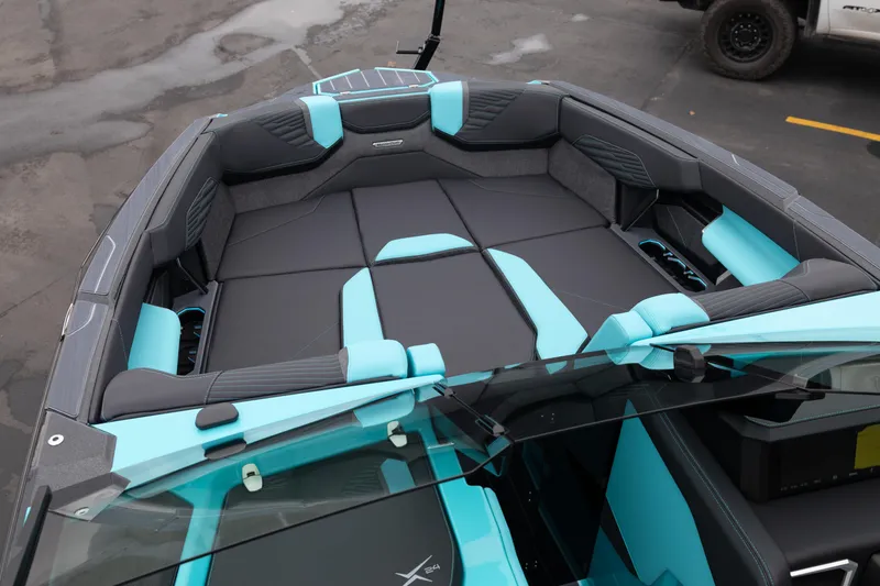 Slide: The Image of 2026 MasterCraft X24 boat interior with turquoise and gray seating, showcasing modern design. - 42
