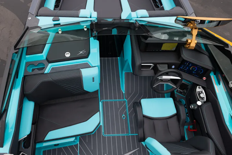 Slide: The Image of 2026 MasterCraft X24 boat interior with modern dashboard and turquoise seating. - 43