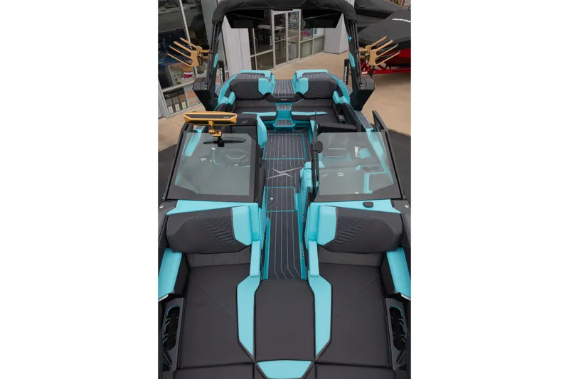 Slide: The Image of 2026 MasterCraft X24 boat interior with sleek black and turquoise design. - 47