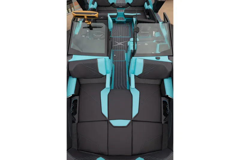 Slide: The Image of 2026 MasterCraft X24 boat interior with sleek black and turquoise seating design. - 48