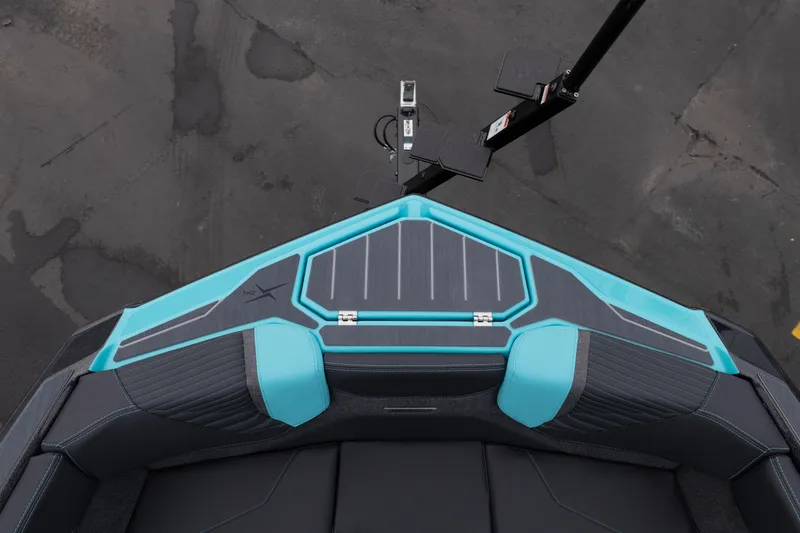 Slide: The Image of 2026 MasterCraft X24 boat interior with turquoise and gray seating, top view. - 51