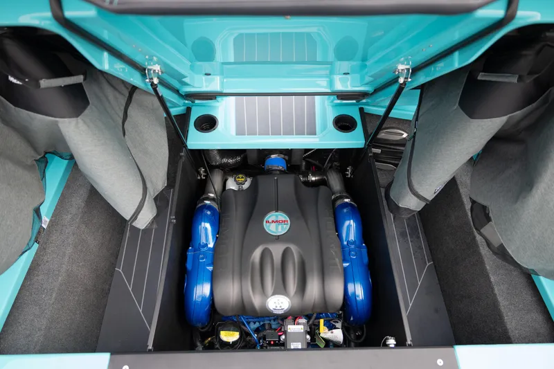 Slide: The Image of 2026 MasterCraft X24 engine compartment with Ilmor engine, showcasing sleek design and vibrant colors. - 56