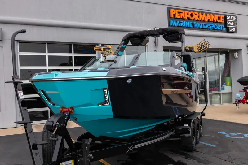Slide: The Image of 2026 MasterCraft X24 boat displayed at Performance Marine Watersports dealership. - 65