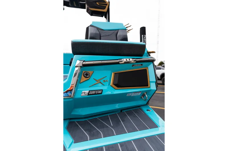Slide: The Image of 2026 MasterCraft X24 boat rear view, featuring SurfStar technology and sleek design. - 69