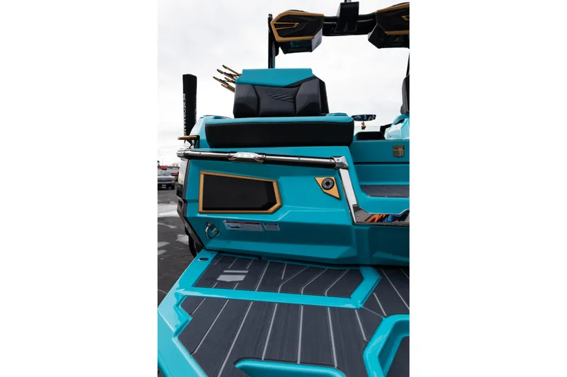 Slide: The Image of 2026 MasterCraft X24 boat interior with sleek turquoise and black design. - 70