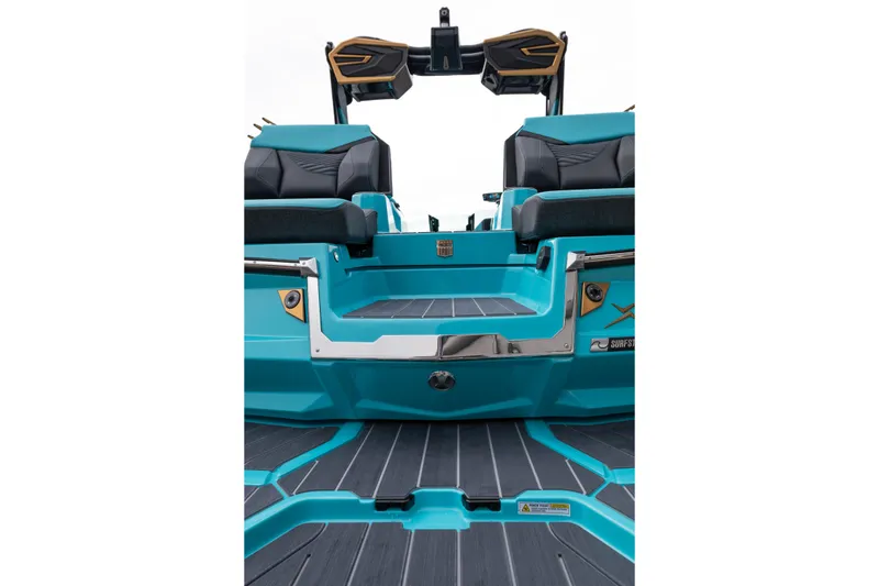 Slide: The Image of 2026 MasterCraft X24 boat interior with teal and black seating, showcasing modern design. - 71