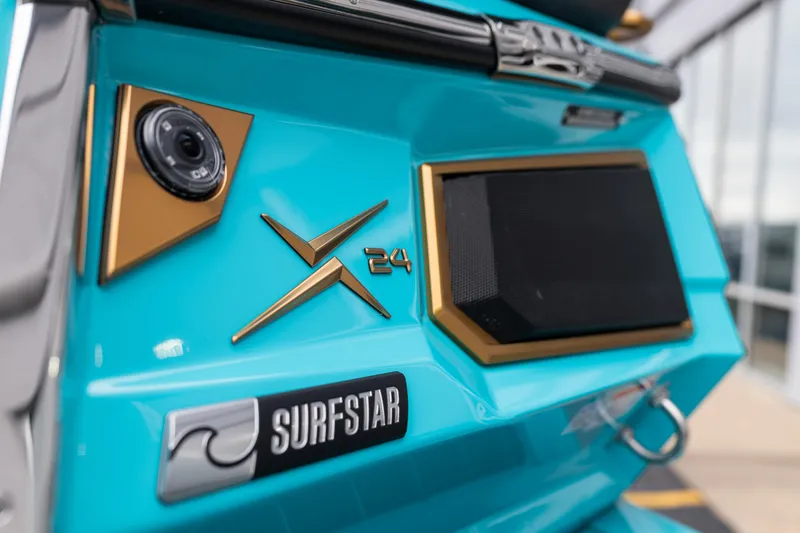 Slide: The Image of 2026 MasterCraft X24 boat with SurfStar feature, showcasing sleek design and vibrant color. - 8