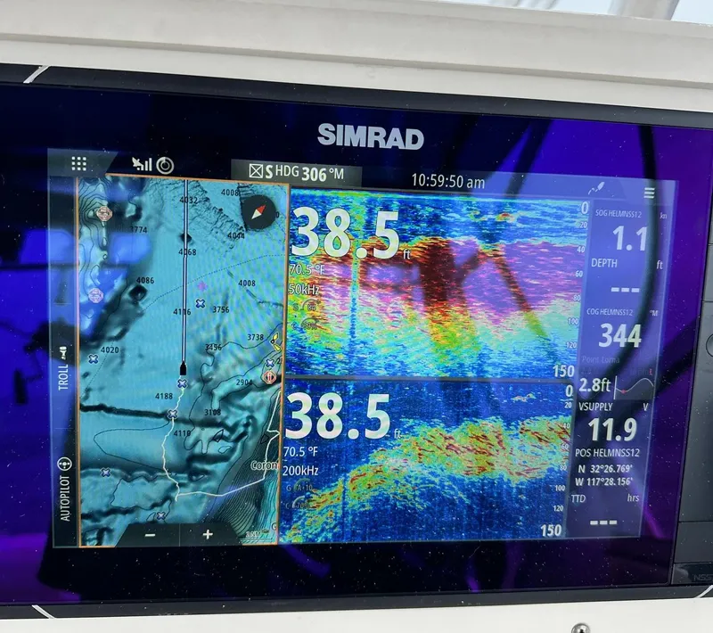 Slide: The Image of Simrad marine display showing sonar and navigation data on a 2003 Grady-White Marlin 300. - 11
