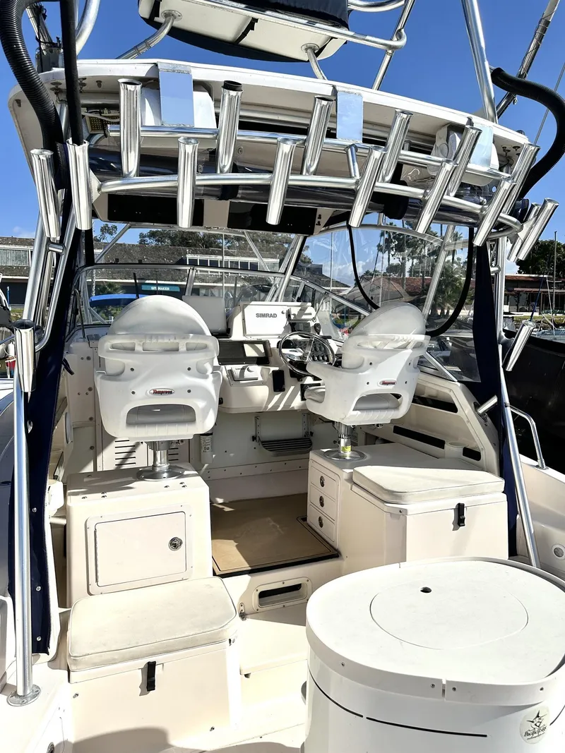 Slide: The Image of 2003 Grady-White Marlin 300 boat interior with helm and seating area. - 19