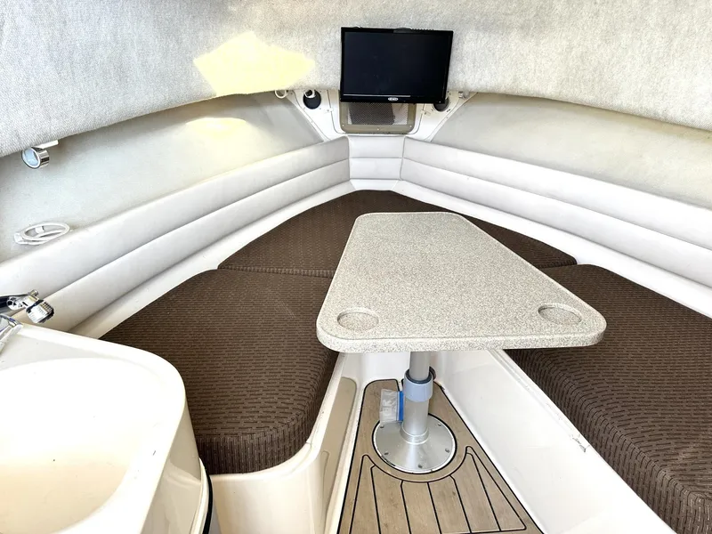 Slide: The Image of 2003 Grady-White Marlin 300 cabin interior with seating and table. - 26