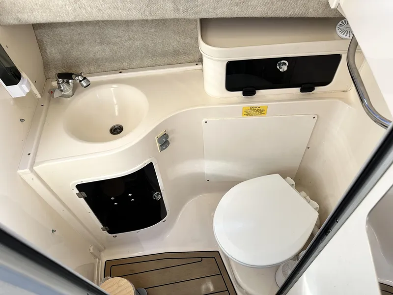 Slide: The Image of 2003 Grady-White Marlin 300 boat bathroom with sink and toilet. - 28