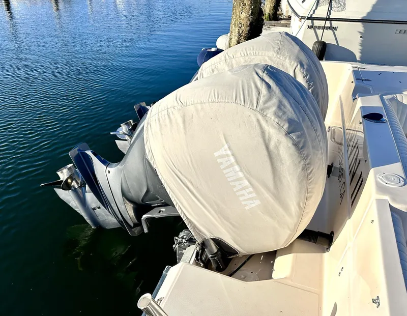 Slide: The Image of 2003 Grady-White Marlin 300 with Yamaha outboard motors, covered and docked. - 31