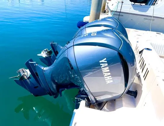 Slide: The Image of Twin Yamaha outboard motors on a 2003 Grady-White Marlin 300 boat. - 32