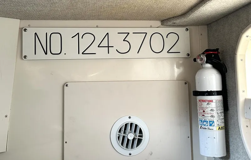 Slide: The Image of Interior of 2003 Grady-White Marlin 300 with registration number and fire extinguisher. - 35